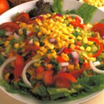 Fiesta Salad Delight: A Colorful Combination of Fresh Vegetables and Tangy Dressing!